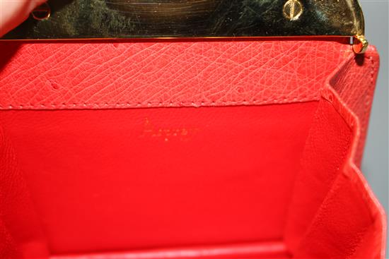 An Asprey red ostrich skin clutch purse, with gilt metal mount and padlock clasp, width 11cm height 12.5cm